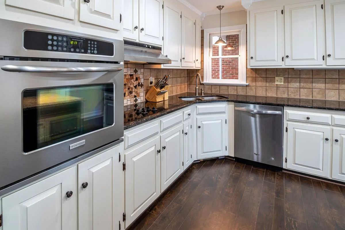 White kitchen cabinets with new hardware