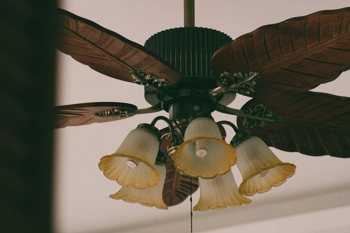 Ceiling fan with light kit installed on a ceiling
